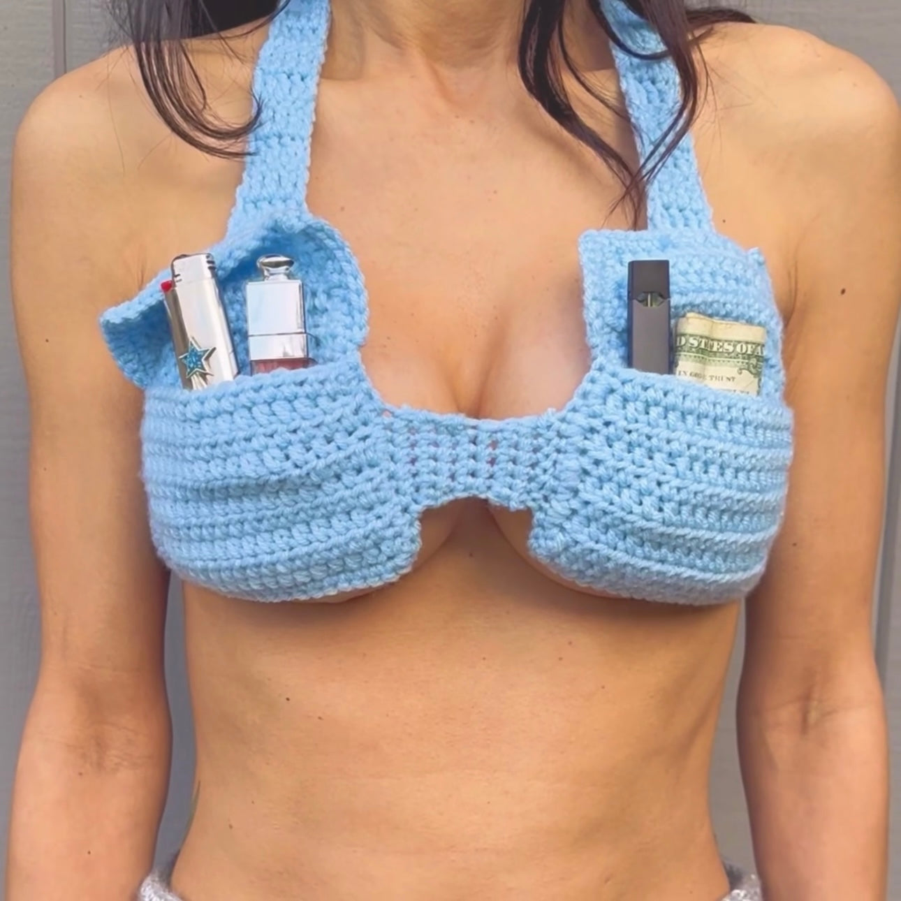 Close-up of the hand-crocheted texture, envelope-inspired pockets, and adjustable tie straps on the Bailey Prado Envelope Bra.