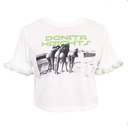 White Baby B graphic tee featuring the "Bonita Heights" print and hand-crocheted ruffle sleeves by Bailey Prado.