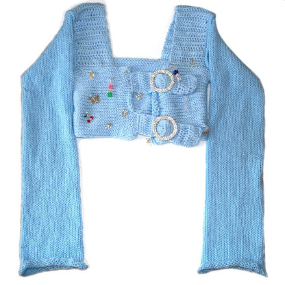 Bailey Prado Blue Long Sleeve Charm Top featuring a baby blue crochet square neck crop top with rhinestone buckle front closures, long sleeves, and mixed charm embellishments.