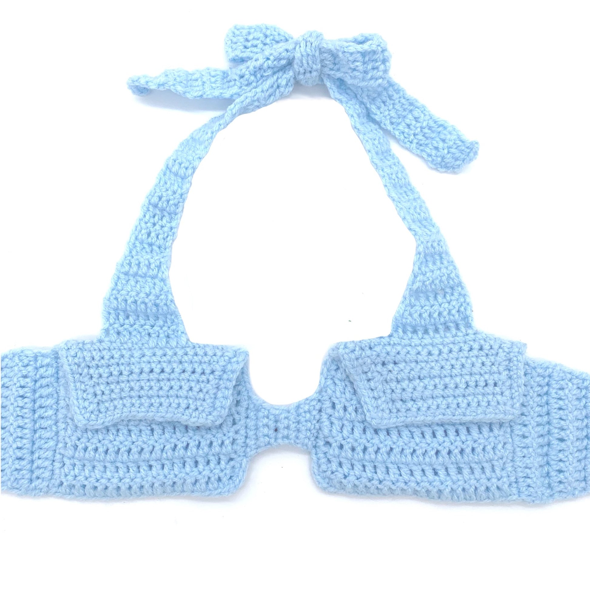 Hand-crocheted baby blue halter top with envelope-inspired pockets and adjustable neck and back ties by Bailey Prado.