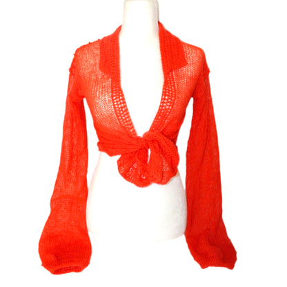 Bailey Prado Mohair Long Sleeve Top featuring a hand-knit orange vintage mohair wrap top with a deep neckline, oversized sleeves, and an adjustable front tie closure.
