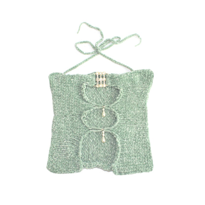 Bailey Prado Sea Green Velvet Top featuring a hand-crocheted sea green velvet halter top with a rhinestone buckle, pearl embellishments, and front cutout detailing.