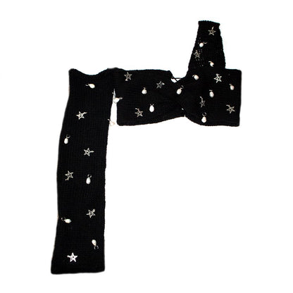 Bailey Prado Starlight Charm Top featuring a black crochet twist crop top with freshwater pearls, silver star charms, one off-the-shoulder long sleeve, and an adjustable lace-up back.