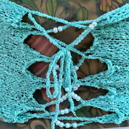 Close-up of the vintage velvet yarn, pearl embellishments, and handcrafted crochet detailing on the Bailey Prado Velvet Teal Tank.