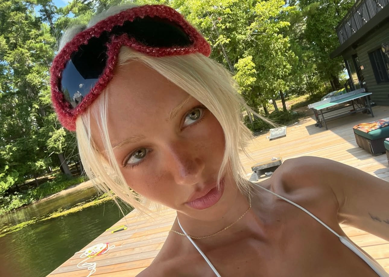 Handmade knitted sunnies by Bailey Prado featuring UV400 protective lenses, available in red, black, pink, and blue.