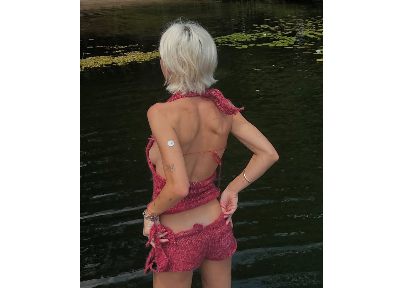 Handmade red knit seashell top and shorts set with shell embellishments by Bailey Prado.